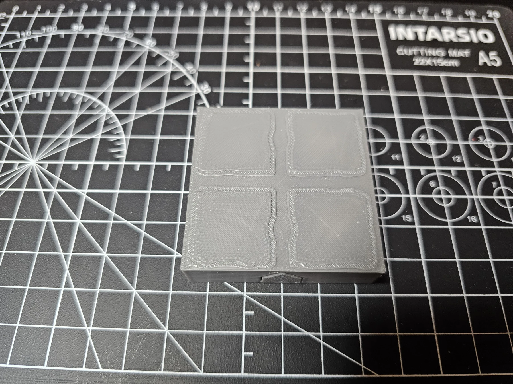 Second top view of a dungeon floor tile on a cutting mat.